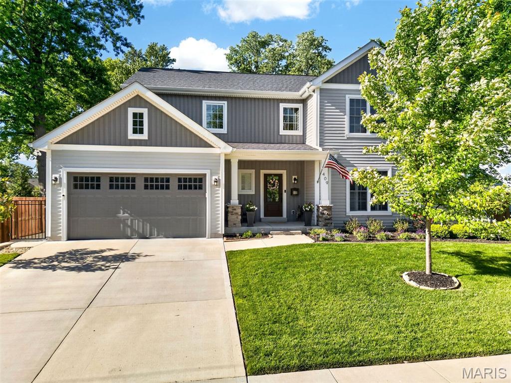 Why wait to build when you can move right into this exceptional 5-year-old custom 1.5-story home by Lewis Homes, which shows like new and is loaded with quality upgrades throughout? Ideally located just blocks from Keysor Elementary, Kirkwood Park, and the shops, restaurants, and entertainment of vibrant Downtown Kirkwood, this 4-bedroom, 3.5-bath home offers the perfect combination of luxury, comfort, and convenience. A welcoming foyer opens to an elegant dining room with crown molding and custom millwork. The open-concept floor plan showcases 9-foot ceilings, hardwood floors throughout the main level, and abundant natural light. The gourmet kitchen is beautifully appointed with custom cabinetry, granite countertops, stainless-steel appliances, and an oversized center island with seating. It seamlessly flows into the breakfast area and the spacious great room, highlighted by a gas fireplace with a custom mantel. Just off the attached two-car garage, the mudroom with custom built-in cubbies and a bench creates the perfect everyday drop zone and is complemented by a convenient main-floor laundry room. The luxurious main-level primary suite features a custom walk-in closet by St. Louis Closet Co. and a spa-inspired bath with dual vanities, an oversized tiled shower, and an Aquatic jetted tub. Upstairs, two generously sized bedrooms share a full bath, providing comfortable accommodations for family or guests. The professionally finished lower level with 9-foot ceilings offers exceptional additional living space, including a large recreation room, fourth bedroom, full bath, and abundant storage. Step outside to enjoy the private, fenced backyard featuring a spacious 24' x 15' patio—perfect for entertaining, outdoor dining, or relaxing. This meticulously maintained home offers all the benefits of new construction without the wait in one of Kirkwood's most desirable neighborhoods.