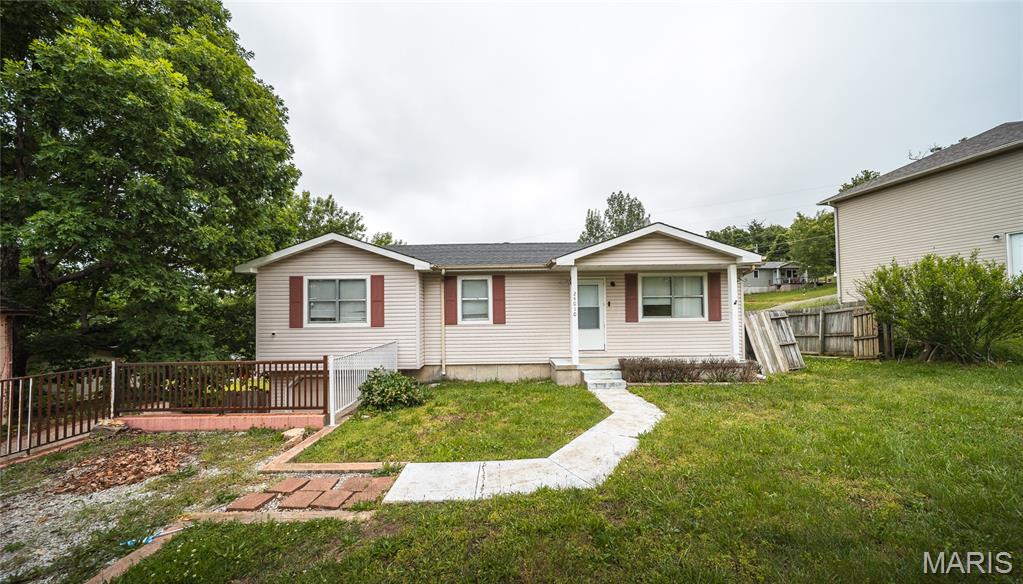 Located in a quiet neighborhood in St. Robert just minutes from the gates of Fort Leonard Wood, this inviting 3-bedroom, 2-bath home offers the perfect balance of comfort, convenience, and space to grow. Whether you're relocating to the area, searching for more room, or looking for a home close to shopping, dining, and everyday amenities, this property delivers the lifestyle you’ve been looking for.

Step inside to a warm and welcoming living space featuring beautiful luxury vinyl plank flooring that flows through the living room and kitchen, creating a modern yet durable foundation for everyday life. The kitchen is designed with both style and functionality in mind, complete with stainless steel appliances and an easy flow into the dining area, making it ideal for entertaining guests or enjoying family dinners at home.

The bedrooms offer a cozy retreat with comfortable carpeting and plenty of natural light throughout. Downstairs, the unfinished basement provides endless possibilities for future expansion, additional storage, a workshop, or a personalized recreation space tailored to your needs.

Outside, the large back deck creates the perfect setting for summer barbecues, morning coffee, or relaxing evenings overlooking the backyard. If you’ve been searching for a move-in ready home in a peaceful location close to Fort Leonard Wood, this is one you won’t want to miss. Schedule your private showing today!