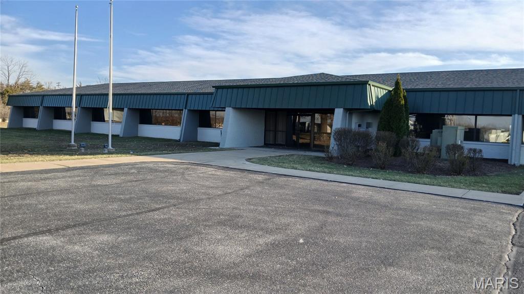 Great opportunity and amazing potential with Building, Parking, and Additional acreage already zoned Heavy Industrial.  Commercial Office Building with 18,000+/- sq.ft. of finished space.  Includes private offices, multiple conference rooms, open space, lobby/reception area, break room/areas on both floors.  Ample parking, outdoor patios and break areas.  Approximately 11.75 acres of total land zoned Heavy Industrial perfect for expansion and/or additional development.  Additional adjacent land available for larger users needing up to 40+/- acres, already zoned Light Industrial and Heavy Industrial.  Building space can be available quickly.