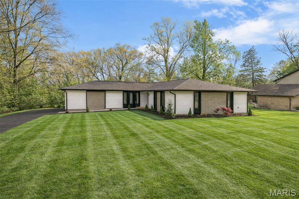 Fully renovated modern home featuring an open-concept layout and high-end finishes throughout. The designer kitchen includes quartz countertops, a large center island, custom cabinetry, and stylish lighting, flowing seamlessly into the main living and dining areas. Updated bathrooms offer clean, modern design with a walk-in shower and quality fixtures. Wide plank flooring runs throughout, creating a cohesive and upscale feel.

The finished basement adds valuable living space with a wet bar and open area ideal for entertaining, a rec room, or additional flex space. Move-in ready with thoughtful updates and strong attention to detail.

Located in a desirable lake community with lake rights and convenient access to the community clubhouse.