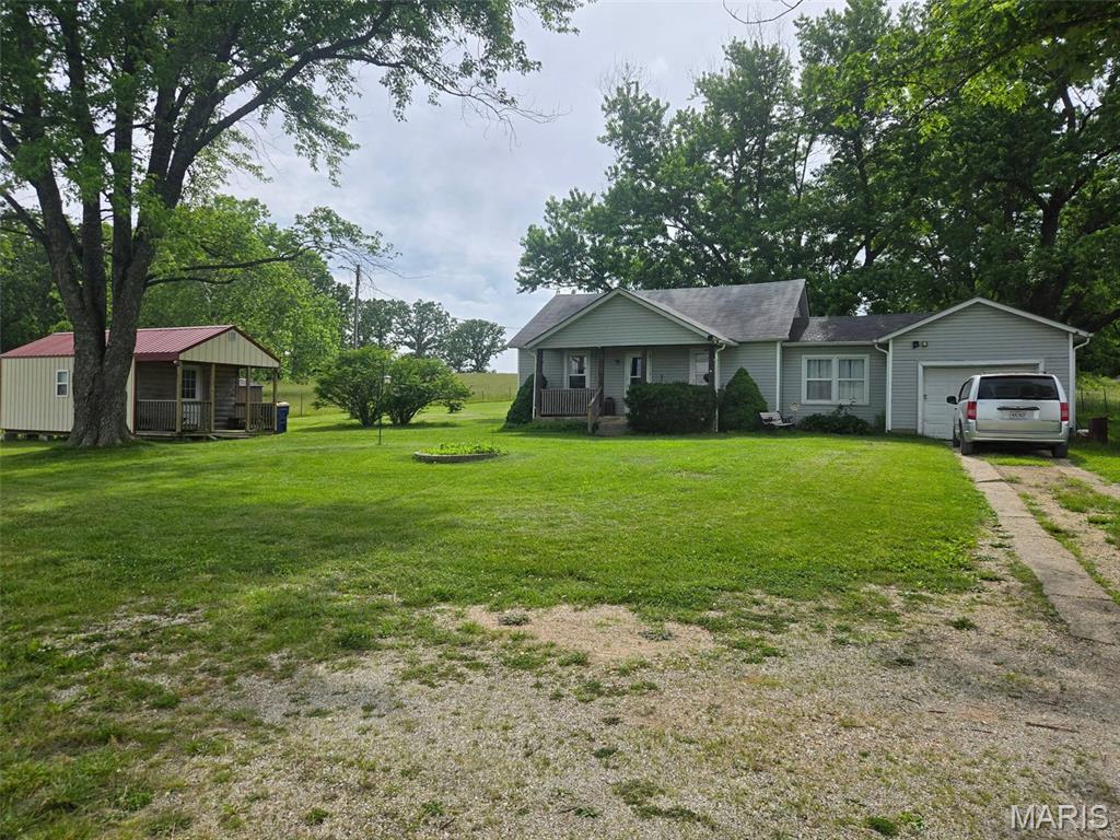 VIP 92 ACRES M/L Three bedroom, 1 bath home on 92 acres in the country, fenced, partially wooded and pasture. Outbuilding. Ranch home with one car attached garage. Come check out this property.