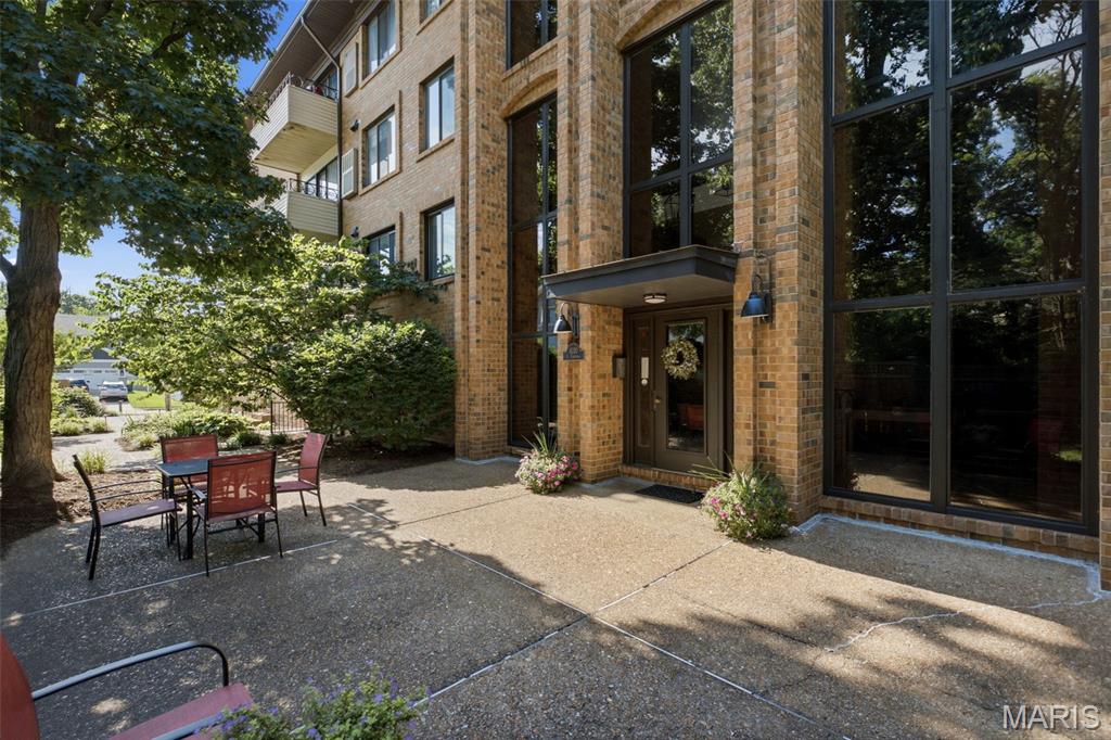 Easy living in the heart of Kirkwood! This thoughtfully updated 2 bed/1 bath condo offers luxury vinyl plank floors paired with a modern color palette providing the perfect backdrop for any style. Moving day just got easier and less expensive because the washer, dryer & fridge are staying! Newer large sliders provide the gateway to outdoor living on the tiled, covered balcony and they flood the living/dining area with loads of natural light as do the newer windows throughout. Stainless appliances, built-in microwave, white tile backsplash, white custom cabinetry, and a lofty tray ceiling with track lighting create a space that’s both attractive and functional. Two bedrooms provide flexible living and the bathroom has been updated to include a glass enclosed shower with timeless subway tile. Storage closet & in unit laundry for added convenience. An assigned parking space in the basement garage is included, and the storage closets will stay! Guests also enjoy basement parking in a second garage. Savor the lush landscaping, relaxing courtyards & peaceful seating areas surrounding the building because your to-do-list doesn’t include yardwork. Lower HOA fee includes trash, water, insurance, snow removal, landscaping & more. An unbeatable location in award winning Kirkwood schools and just steps from charming shops, eateries & boutiques. Don’t miss your chance to call it home!