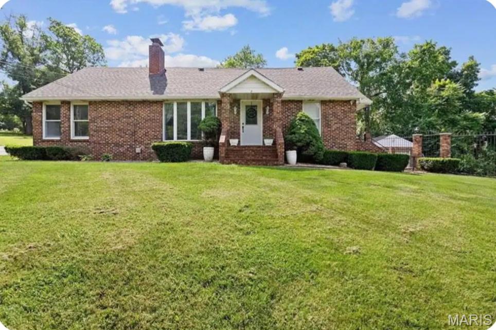 Stunning 4 bedroom, 3 bath brick home located within walking distance of downtown. You will not find another property like this. Seller is adding an additional lot to be sold with this property to go all the way to Purcell (legal to be determined). The custom wrought iron fence surrounds the entire property with double gate entrance and circle asphalt drive way. This home is a must see! Features an open floor plan with wood floors, walk in pantry, separate dining, large mud room/laundry, detached 1 car garage and so much more. Primary suite is located on the main floor with walk in shower. Home has a partial basement with sleeping area. You will love the patio out back for entertaining. Call today to set up your private showing.