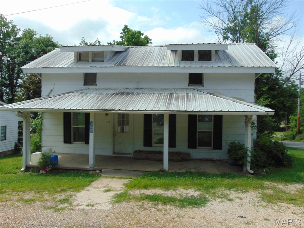 This home was a rental and could be again with some work. It could be lived in as is, but really needs some TLC to make it nice. Would make a great rental, starter home, or flip property. 2 bedrooms and one bath downstairs with kitchen, living room, dining, and utility rooms. Upstairs there is one more bedroom and a 2nd room that could be used as an office, playroom, or 4th bedroom. The house is in an "X" flood zone which means it is low risk of flooding, but possible. Water did get under the house during the historic flood of 2017 but did not get in the house. Home sits on the corner close to the heart of Doniphan and within walking distance of beautiful Current River! While this home needs some work, it is priced accordingly. You will be hard pressed to find anything else in this price range.