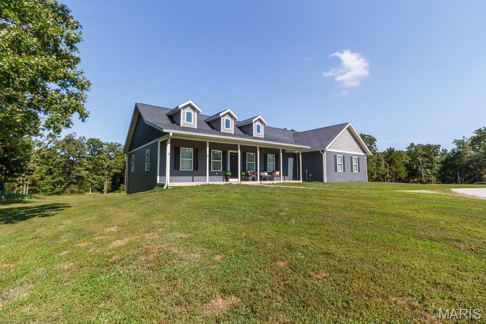 LOOKING FOR A PROPERTY WITH MULTIPLE LIVING QUARTERS??? This like-new basement home offers approximately 4,200 square feet of spacious, well-designed living space, perfectly situated on 12 beautiful and private acres just outside of Lebanon. Tucked away in a peaceful rural setting, this property is ideal for families seeking room to grow, entertain, or simply enjoy the tranquility of country living while still being close to town conveniences. The main home features an open and inviting layout with high ceilings, abundant natural light, and quality finishes throughout. The expansive kitchen boasts custom cabinetry with modern appliances, making it a perfect centerpiece for gatherings. The primary suite provides a luxurious retreat with a spa-like bath and generous walk-in closet, while additional bedrooms and living areas—including a fully finished basement—offer ample space for children, guests, or a home office setup. One of the standout features of this estate is the large detached shop, which includes its own fully equipped living quarters—ideal for extended family, guests, or even rental income. Whether you're accommodating in-laws, adult children, or need a separate space for a home business or hobby, this flexible setup checks every box. With plenty of room for outdoor activities, gardening, or future expansion, this property combines comfort, function, and the rare kind of privacy that’s hard to find—all just minutes from the heart of Lebanon.