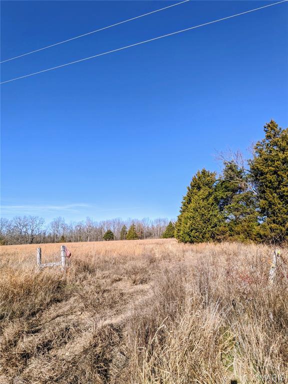 Slip away from the noise and escape to the country with this private 8.78 acre slice of peace and possibility. With no known restrictions and wide-open potential, this property is ready for your off-grid cabin, weekend basecamp, homestead, or the dream retreat you’ve been waiting to build.

The land lays mostly flat and is surrounded by tree lines on three sides, offering a natural privacy buffer and a true back-to-nature feel. A spring-fed wet weather pond, bordered by large mature cedar trees, becomes a quiet gathering place for wildlife during the changing seasons. A wet weather creek borders the far side of this acreage, adding to the property’s raw beauty and natural character.

Native grasses and a pumpkin patch were previously planted to help restore and protect the soil enriching the ground—ideal for future gardening, hobby farming, or sustainable living plans. Fencing is in place along three sides to give you a head start on bringing your vision to life.

Tucked away, yet within five miles of Mark Twain National Forest and less than 30 miles from Rolla, you’ll find the perfect balance of solitude and convenience. Electric poles run along Private Drive 6245 leading up to the property, making future utility access more attainable when you’re ready.

Whether you’re looking to unplug for the weekends or create a self-sufficient homestead, this beautiful acreage is your opportunity to build a life a little slower, quieter, and closer to the land.