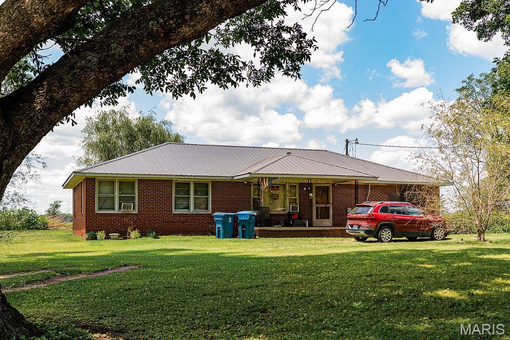 Enjoy peaceful country living with this 3-bedroom, 2-bath home situated on approximately 1 acre and surrounded by beautiful farmland views. Offering 1,711 square feet of living space, this property features a newer metal roof installed in December 2025, a newer HVAC unit installed in 2022, a solid brick exterior, hardwood flooring, and a bonus room that could serve as an office, playroom, or additional living space. Don’t forget the covered front porch, perfect for enjoying the quiet surroundings. With plenty of room both inside and out, this home offers an excellent opportunity for a first-time buyer, investor, or anyone looking to add their own personal touches. Conveniently located while still providing the privacy and peacefulness of rural living. Don’t miss out on a chance to see this home!
