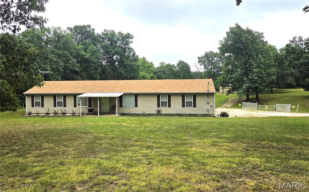 Looking for a Private setting on 5+/- ACRES!  Here it is with some fencing and cross-fencing and 24x48 Barn with water, electric and 2 (11x9) stalls plus storage area ready for your HORSES, goats, cows- you name it and plenty of room for your tractor, equipment and toys. The stalls were constructed with boards cut from the trees harvested on site! The spacious Ranch home offers 1400 Sq.Ft. with 3 spacious bedrooms, large open Great Room, formal Dining Room and eat-in Kitchen and don't forget the main floor laundry.  The oversized attached garage is 2.5 cars wide and deep enough for a crew cab pickup!  Also included is a 18x30 Carport.  Great fenced in back yard for the pets and kids with a large covered patio.  The property lays great and is ready for your horses, goats, cows or for recreation/privacy.  Conveniently located on Hwy 21 not far from Washington State Park and just out of De Soto.  You can enjoy nature and your livestock from your private back porch.