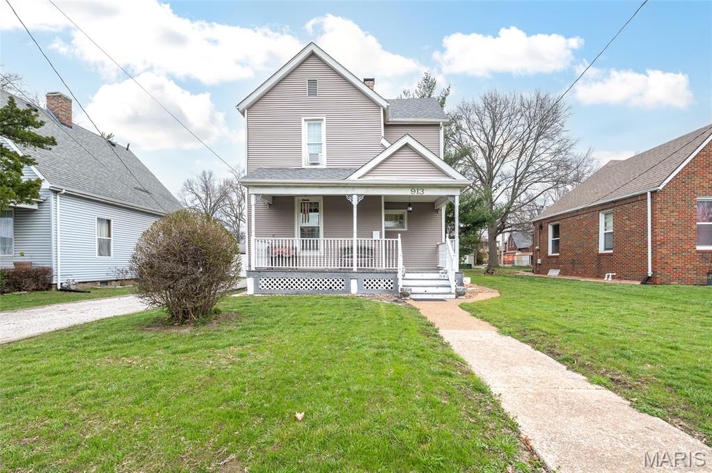 Historic Charm Meets Modern Convenience in Heart of Collinsville!
Step into a piece of local history! This well maintained 2-story home perfectly blends timeless character with the practical features today’s buyers demand. From the moment you arrive, you’ll be charmed by the classic covered front porch—the perfect spot for your morning coffee.
Inside, you are welcomed by an inviting, traditional layout. The main level offers a spacious living room and dining room, ideal for hosting friends and family, complemented by a convenient half-bath. Ascend the stunning, original wood staircase to find three generously sized bedrooms and a full, character-filled bathroom.

Need extra space? The basement provides dedicated areas for laundry, abundant storage, and a versatile workout space to suit your lifestyle.

Outdoor Oasis & Parking:
The home’s exterior is designed for easy living. Relax or entertain on the massive back deck featuring built-in seating. Parking is a breeze with an attached 1-car garage, alley-access parking, and a convenient front-to-alley driveway—a rare, highly functional feature for the area!

Situated in a vibrant, walkable neighborhood, this home offers the unique blend of historic charm and modern utility you’ve been waiting for. Don’t miss your chance to own this Collinsville gem.

Schedule your private tour today—this one won’t last!