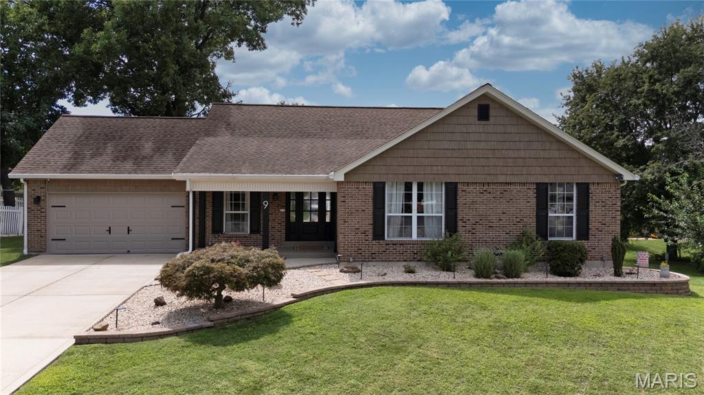 Welcome to this beautifully updated, move-in ready 4-bedroom, 3.5-bath ranch nestled on a cul-de-sac in St. Peters! From the inviting main level to the thoughtfully finished walk-out lower level, this home offers stylish upgrades, smart design, and exceptional flexible living space throughout.

The main level features three bedrooms, including a primary with an ensuite bath showcasing a walk-in shower. The updated kitchen is a true standout with quartz countertops, oversized 14" deep soft-close cabinetry, a pantry, and black stainless Whirlpool appliances. The kitchen flows seamlessly into a vaulted living space accented with stylish beams, creating a warm, open, and inviting atmosphere. This versatile area can function as a dining room or family room, with additional living space located at the front of the home. Main-floor laundry, conveniently tucked behind a stylish barn door, adds everyday convenience.

The finished walk-out basement significantly expands the home’s livability and functionality, featuring brand new flooring throughout, a spacious recreation room with a dedicated nook perfect for a media area or game space, a wet bar, and a versatile flex room currently used as a gym. The lower level also includes a private 4th bedroom—ideal for guests or extended stays—along with a full bath, a half bath, and abundant unfinished storage space with built-in shelving. This basement adds an estimated 1341 sq ft of additional living space!

Step outside to enjoy the composite deck and patio overlooking the backyard, thoughtfully designed so you can comfortably relax even when it’s raining. This covered outdoor feel makes the space truly usable year-round, whether entertaining or unwinding.

The driveway offers parking for approximately six vehicles, while the attached two-car garage features epoxy flooring, cabinetry, and an insulated garage door.

There are too many updates and thoughtful features to list—this is a home you truly need to experience in person. With extensive renovations, a desirable cul-de-sac location, and a thoughtfully designed layout on both levels, this St. Peters home is ready to impress!
