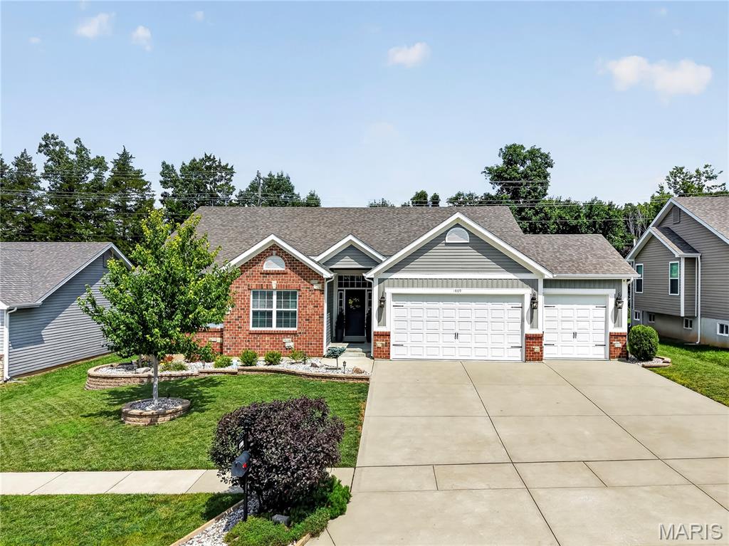Meticulously maintained home on a level, fully fenced lot with thoughtful indoor-outdoor living. The reverse-vaulted great room opens seamlessly to the breakfast room and kitchen, creating an inviting, sunlit gathering space ideal for everyday living and entertaining. The kitchen is a highlight, appointed with rich wood cabinetry, a center island with breakfast bar, granite countertops, stainless steel appliances and a walk-in pantry. Adjacent breakfast space provides casual dining with easy access to the backyard patio. The primary suite is a private retreat featuring a coffered ceiling, luxury ensuite bathroom and a walk-in closet. The lower level expands the home’s livability with a large family room finished with a custom wall of built-ins, a dedicated recreational area with a bar, hobby room, additional bedroom and a full bath and plenty of storage. Outside, the owners have created a fabulous entertaining area with an extended patio, built-in fire pit and plenty of green space. A three-car garage, freshly painted main level and well-maintained systems round out the many amenities. This home truly has it all and is an absolute must-see!