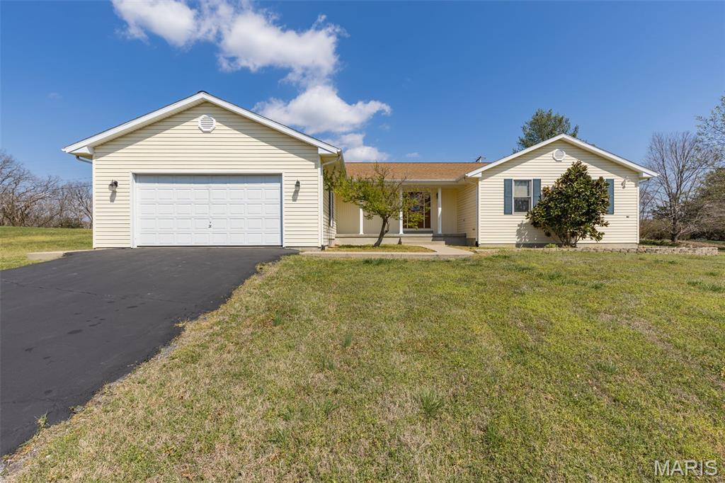 OPEN HOUSE Sunday the 28th form 1-3pm. HUGE PRICE IMPOVEMENT!   The lakes are all ready for your summer actives!! Very nice Ranch home with 1,779 sq ft on level lot in Lake Forest. Lake living at its best. Living room has a brick woodburning fireplace with mantle. Home has 3 bedrooms, 2 full bathrooms, and a half bath, cathedral ceiling, separate dining room, main floor laundry room, lots of closets for storage, eat-in kitchen, ceramic backsplash, fresh paint, and full basement. All kitchen appliances stay. Patio, covered front porch, and a back yard that backs to common open ground. 2-car oversized garage with opener. Lake Forest offers a beautiful community pool with lifeguards, recreation center, basketball and pickle ball courts, and 3 lakes for water skiing, boating, fishing and tubing. Relax at home! Boat, trailer, and camper storage area. Close access to I-55. Come look at this fantastic home, you will not be disappointed!  Plus, the Seller is offering a 1- year home warranty to the buyer.