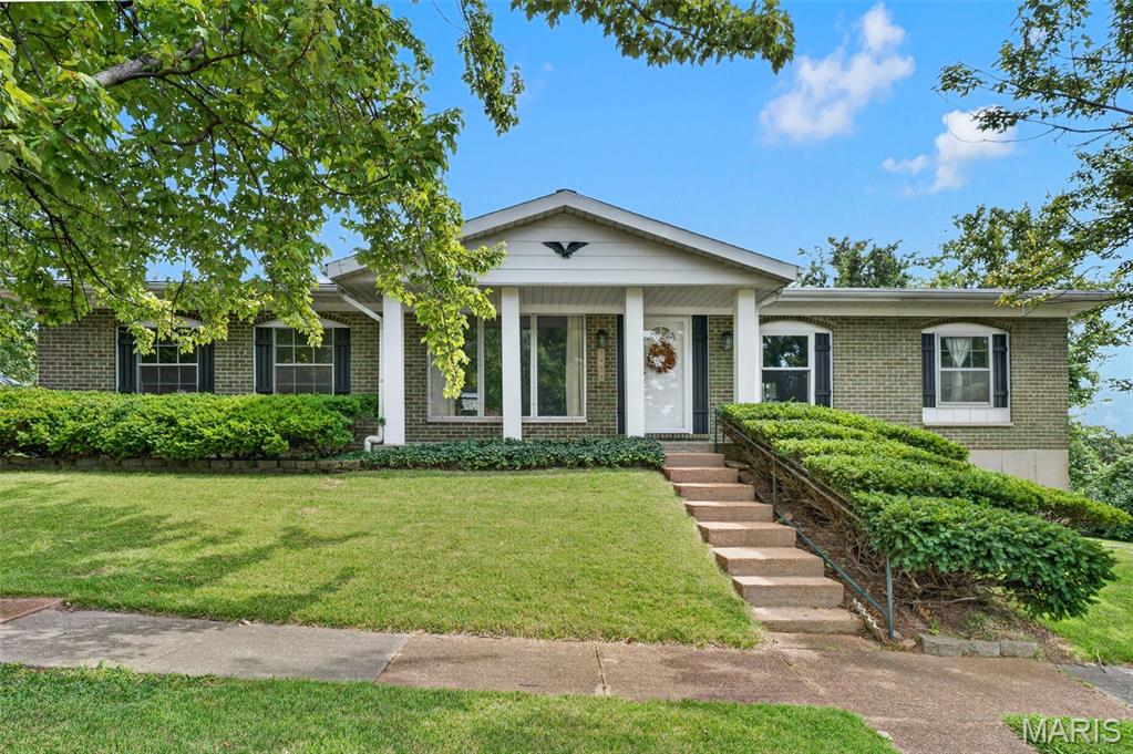 Welcome to 3434 Laura Lane! This fantastic South County ranch sits on a spacious corner lot in the highly sought-after Mehlville School District, conveniently located just minutes from local shopping, dining, and easy highway access.

Step inside to low-maintenance laminate wood flooring running throughout the main living areas, beautifully accented by classic crown molding. The heart of the home features a well-appointed kitchen outfitted with rich maple cabinets, solid granite countertops, and sleek stainless steel appliances. A movable island (negotiable) offers great flexibility for extra prep space or entertaining guests. Just off the kitchen, the comfortable family area centers around sliding glass doors that open up to a private covered patio—the ideal setup for summer BBQs, morning coffee, or relaxing outside.

The main level boasts three comfortable bedrooms and two thoughtfully updated full bathrooms.

Hall Bath includes a crisp white vanity, updated ceramic tile flooring, and a ceramic tile shower surround.

Primary Bath features a sleek modern vanity, a step-in walk-in shower, ceramic tile flooring, and a convenient medicine cabinet for extra storage.

You will also appreciate the big-ticket systems peace of mind this property delivers, including 2 newer front windows, a 2-year-old water heater, and a roof that is only 8 years old.

Outside, the broad corner lot features a partially fenced yard with plenty of room for pets, play, or gardening. Rounding out the property is an attached 2-car side-entry garage and an expansive unfinished walk-out basement—a blank slate ready for your finishing touches, whether you envision a full recreation room, home gym, workshop, or abundant storage space.

Don't miss this complete package—schedule your private tour today!