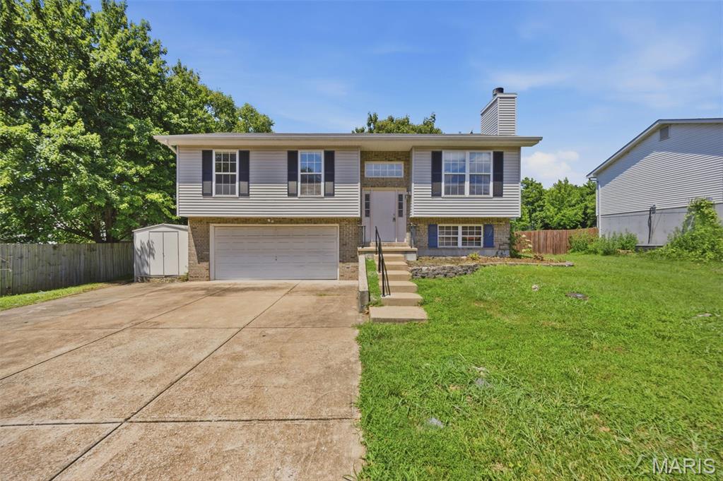 Discover the charm of 1001 Parc Central Drive in Festus! This freshly painted, move-in ready split-level home invites you in with a bright, open-concept living space highlighted by vaulted ceilings and a warm, cozy fireplace. The heart of the home, the kitchen, boasts brand-new cabinets and flows effortlessly into the dining area. Step outside from the dining space onto a large deck that overlooks an expansive, generous backyard—perfect for entertaining or relaxing. The lower level adds incredible versatility to the home, featuring a full bath, laundry area, and extra living space ideal for a home office, recreation room, or family room. Complete with a 2-car garage and a well-maintained lot, this property is ready for its next owners to move in and enjoy.