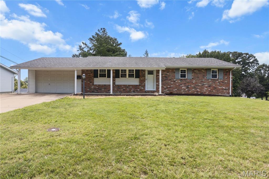 Nicely updated home in the Alexander Heights subdivision, located in the heart of Festus. This home offers an open floor plan with several updates throughout. The oversized 2-car garage and spacious, level yard add to the home’s appeal.
The kitchen features stainless steel appliances and a large island that provides additional seating, perfect for entertaining or everyday family living. The main level includes a separate dining room, a large open great room, a spacious main bathroom, two generous bedrooms, and a primary suite with an updated bath and walk-in shower.
The partially finished, walkout lower level offers a family room (just add flooring to complete), a bonus room, and a half bath ready for your finishing touches. There is also plenty of storage space. The walkout leads directly to the backyard, making it ideal for outdoor enjoyment.
This home combines updates, functionality, and a great location—ready for its next owner.