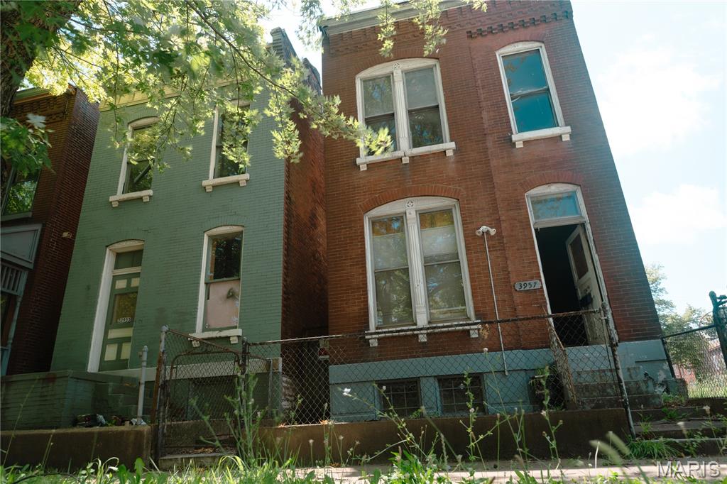 Investor Alert: Turn-of-the-Century Historic Revival Opportunity

This property is being sold as a package deal with the property next door, 3955 N. 11th St. Don’t miss out on this rare chance to acquire a double-lot footprint and maximize your return on investment in a rapidly growing pocket of St. Louis.

Welcome to an incredible chance to bring a piece of St. Louis history back to life! Located at 3957 N. 11th Street, this 1895 all-brick home is a perfect opportunity for investors, historic preservationists, or anyone looking to craft a custom urban masterpiece.

This historic property offers incredible layout versatility depending on your investment goals:
-Single-Family Conversion: Transform the layout into a single-family residence.
-Two-Family Duplex: Maintain the current setup as a revenue-generating 2-family rental.
-Combine both properties to create 4-plex or large single family home.

The bones of this home showcase the craftsmanship of the late 19th century, featuring rare architectural details that are highly sought after by modern buyers:
-Soaring 10-foot ceilings across the entire main floor, creating an incredibly bright, open, and airy feel.
-Features a massive, 9-foot original wood pocket door—a stunning focal point for any main-floor living space.

Includes a newer electrical panel box already installed, saving you time and initial infrastructure costs.

Situated on a unique block, this property sits in an area experiencing a wave of neighborhood revival and reinvestment.
Quietly positioned as one of only three homes on this specific section of the street, offering rare privacy in an urban setting.
Just a short, easy walk to historic Hyde Park, giving future residents quick access to local green space and community charm.

Property is being sold in as-is condition. Bring your contractor and your imagination to unlock the massive potential of this historic gem!
-------------------------------------
NOTE:  St. Louis City offers excellent tax breaks for rehabbing an 1895 historic home. 
Property in Hyde Park is highly likely to be eligible for both available programs.  If interested, buyer should do their own due diligence / research.
