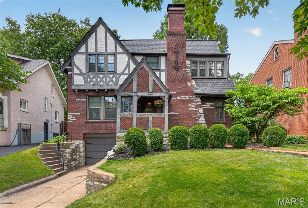 This quintessential University City home is nestled in a tight-knit neighborhood just moments from downtown Clayton, Washington University, and Forest Park. Full of charm and character, this Tudor-style home features hard wood floors, an elongated garage fitting a mid-size SUV along with plenty of storage space, and an adorable backyard with mature landscaping, built-in gas grill, and new patio.

The main level offers a spacious living room with gas fireplace, separate dining room, updated kitchen, and convenient powder room. The kitchen was remodeled within the last 10 years with heated floors, updated cabinetry & backsplash, and stainless steel appliances. Upstairs, timeless charm continues with a period-style landing featuring a built-in bench, floor-to-ceiling bookcases, and original stained glass windows. You’ll find three bedrooms with large closets and a fully renovated bathroom with jacuzzi tub and travertine tile.

A partially finished basement provides additional living space, storage, and wine cellar. The seller has lovingly maintained the property with major updates including a roof less than 10 years old, updated water line, most storm windows replaced, and renovated bathrooms and kitchen.  This home has forced air and steam heat with a newer boiler.  Washer and dryer are located in the basement.

A must-see home in an unbeatable location!