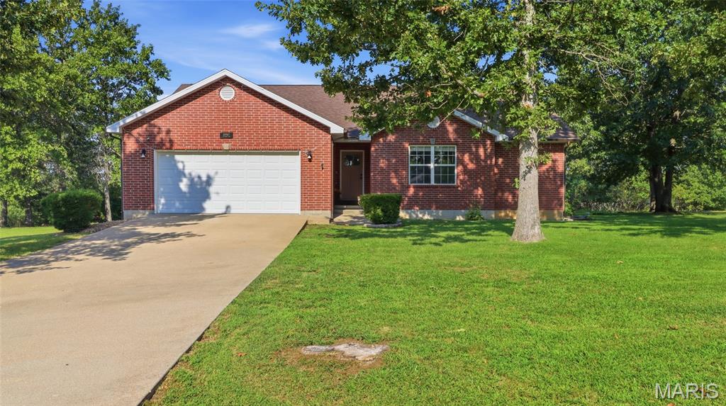 Welcome home to this beautifully updated 3-bedroom, 2-bath residence nestled in a quiet subdivision just outside the Waynesville city limits. Offering the perfect balance of peaceful living and everyday convenience, this move-in ready home is just a short drive from Fort Leonard Wood, shopping, dining, and local amenities while providing a relaxing neighborhood atmosphere you'll love coming home to. Step inside to discover a bright, open floor plan designed for both comfortable living and effortless entertaining. Brand-new luxury vinyl plank flooring flows throughout the main living areas, creating a fresh, modern feel that's both stylish and durable. The spacious kitchen seamlessly connects to the living and dining areas and has been updated with a new refrigerator and dishwasher, making meal preparation and hosting a breeze. The private primary suite is a true retreat, featuring a spa-inspired bathroom with dual vanities, a relaxing Jacuzzi tub, and a separate shower—perfect for unwinding after a long day. Two additional bedrooms provide flexibility for family, guests, or a home office. Outside, you'll appreciate the extensive exterior improvements, including a brand-new roof, and new gutters, offering both peace of mind and enhanced curb appeal for years to come. With so many major updates already completed, all that's left to do is move in and enjoy. If you're searching for a beautifully updated home in a desirable location with modern upgrades and a welcoming layout, this property checks every box. Schedule your private showing today and see why this Waynesville-area home is the perfect place to start your next chapter!