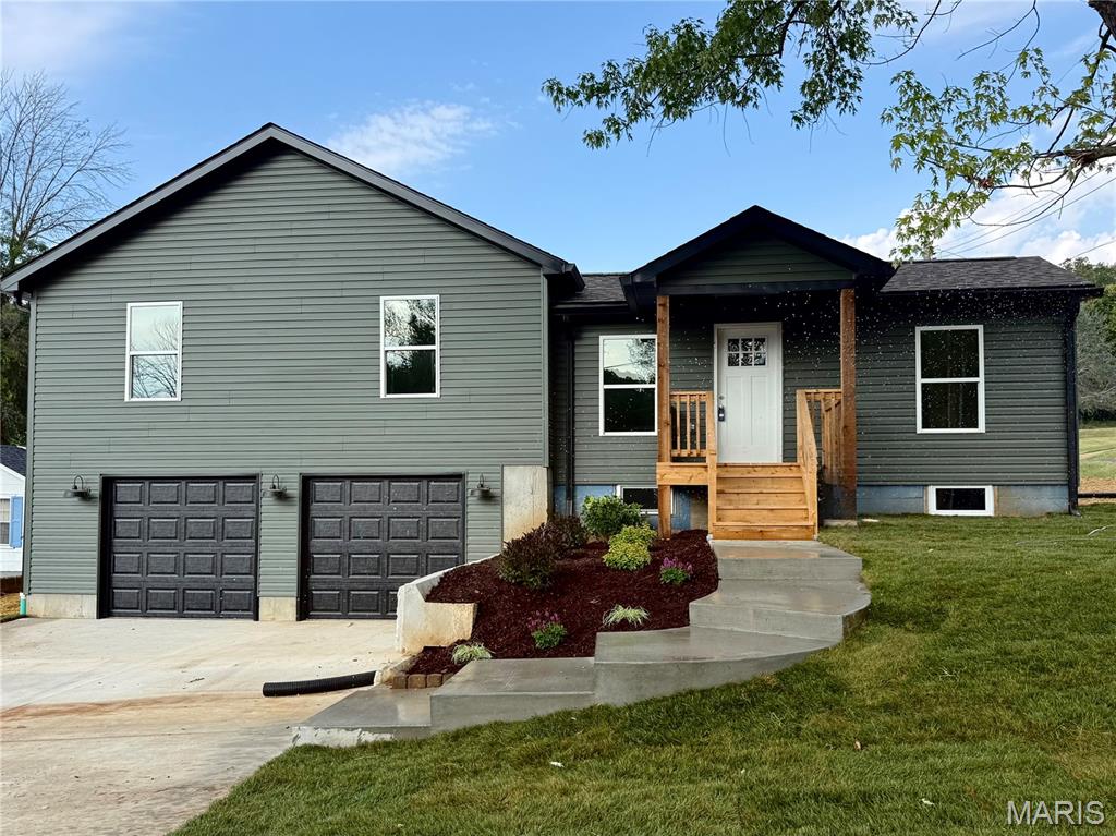Oh wow - this charming home has been beautifully brought back to life, and you won’t want to miss it. Step into the inviting main level featuring an open floor plan with a bright living room, updated kitchen, pantry, breakfast area, and convenient half bath. Just off the kitchen, a private back patio extends your living space outdoors; perfect for BBQs, entertaining, or simply enjoying the day. Upstairs, you’ll find two bedrooms, a hall bath, a laundry closet, plus a primary suite complete with its own bath. Don’t forget to admire the stunning tilework in the shower. A tuck-under two-car garage and a full basement offer excellent storage. This home blends charm, updates, and functionality in all the right ways - check it out today!