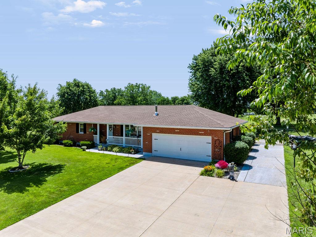 Escape to the peace and quiet of country living without sacrificing modern conveniences! This well-maintained 3-bedroom, 3-bath brick home sits on a beautiful 1.48-acre lot just a few miles south of Bloomsdale, offering plenty of space to spread out both inside and out. The spacious backyard is fully fenced and ready for your hobby farm or homestead dreams, featuring chicken coops, raised garden beds, fruit trees, and room to roam. A large solar panel array helps keep electric bills surprisingly low during the summer months, while the cozy wood-burning stove provides an efficient and inviting heat source throughout the winter. Inside, you'll find comfortable living spaces along with a finished walk-out basement complete with a full bathroom, abundant storage, and endless possibilities for a family room, recreation space, home office, or guest suite. Step outside onto the back deck and enjoy peaceful views of your property—perfect for morning coffee, grilling, or relaxing evenings. Major updates provide added peace of mind, including a new A/C system installed in 2023, a roof that's approximately six years old, and a premium septic system and sump pump installed by Woods Basement Systems. The attached two-car garage and generous storage throughout make this home as practical as it is charming. If you've been looking for an energy-efficient country property with room to garden, raise chickens, entertain, and enjoy the outdoors, this one checks all the boxes. Schedule your showing today!