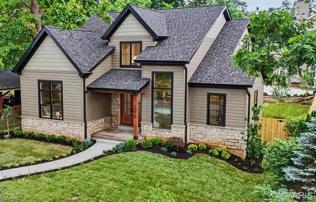 Within walking distance to coveted Tillman Elementary and North Kirkwood Middle Schools, this amazing New Construction home, now complete at 246 Barter Ave, Kirkwood, MO 63122, is a real Kirkwood marvel with over 4200 sqft of total living space! This single-family residence with first floor primary suite is complete with 5 Bedrooms and 4.5 Baths.  Light filled open floor plan with 9' ceilings on all levels, french white oak hardwood flooring on main level and 2nd floor loft and hallway. Gourmet center isle kitchen with custom Amish cabinetry, GE Cafe Matte White appliances, custom built range hood, solid surface tops and Zellige tiled backsplash and access to covered patio.  Master Suite offers private bath with custom tiled shower. Finished lower level includes bedroom, bath and rec room and tons of unfinished storage space.  Plumbing fixtures from brands such as Kohler, Swiss Madison, Moen and Delta in all bathrooms, laundry rooms and Kitchen.  Designer-not builder grade tile selections used in all full bathrooms, first and 2nd floor laundry rooms and mudroom.  The exterior stands out with Douglas Fir Timbers, Real Stone and LP Smartside lap and shingle siding to last for many years to come with no maintenance or worries of hail damage.  Detached two car garage with walkway in to dedicated mudroom featuring built in custom cubbies right next to a dedicated first floor fully appointed main floor laundry room.  And no need to worry about bringing the kids clothes down from the 2nd floor, we didn't forget about a 2nd floor laundry room either!  Fully landscaped, sodded and irrigated partially fenced in beautiful yard on one a nice quiet street in Kirkwood! This is your chance to own a slice of the good life; inquire today and prepare to fall head-over-heels!