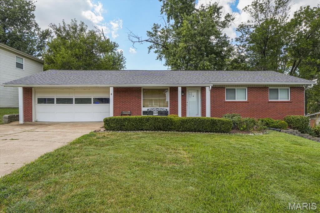 From the moment you arrive, this inviting ranch makes a great first impression with its classic exterior, cheerful curb appeal and welcoming covered front porch. Tastefully updated, the home offers a comfortable, easy-living design featuring popular gray hues, hardwood floors, and an open floor plan that flows seamlessly for today’s lifestyle. A large front window fills the space with natural light and provides a nice view of the front yard. The bright kitchen features stainless steel appliances, a panty, ample cabinetry and convenient access to the dining area. Three cozy bedrooms offer hardwood flooring and sizeable closet space, including a primary bedroom with the convenience of a private half bath. A refreshed full hall bath serves the additional bedrooms and guests, completing the home’s functional main-level layout. The walkout lower level adds an impressive amount of usable space, including a large recreation room ready for movie nights, a playroom or casual gatherings. Additional finished space offers plenty of flexibility for a home office, fitness room, hobby space or guest area, with extra room for storage as well. Step outside to a big fenced backyard with room for pets, play, gardening, a firepit and outdoor enjoyment. The oversized two-car garage is another standout, providing extra parking, storage and workspace. Conveniently located near schools, shopping, dining and major highways, this home delivers a winning combination of plenty of room to live, work, play, and grow.