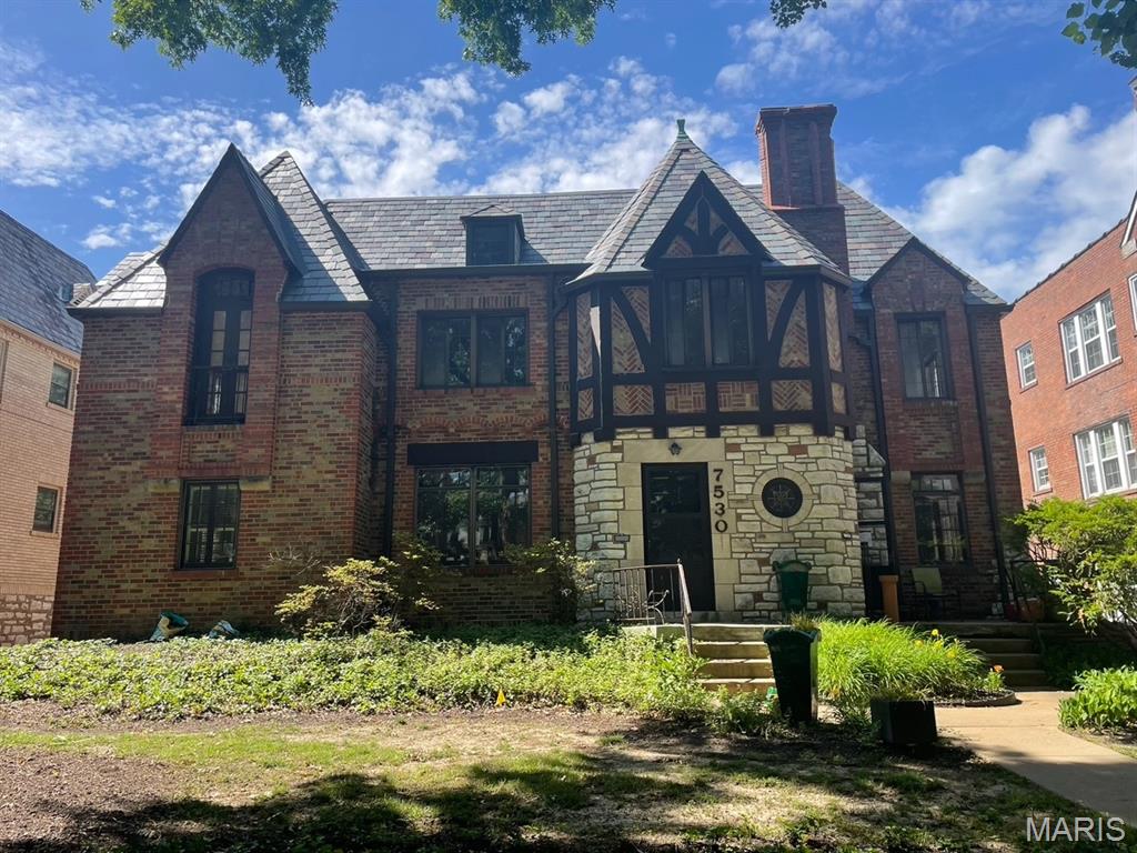Architecturally significant English Tudor two family in the heart of Clayton. This beauty stands sound and ready for her new ownership to bring her back to her best. The details found within are gorgeous, and will be highlighted beautifully once she has been brought back. She boasts a beautiful brick and stone exterior, and interior features including; ornate plaster work, casement windows, brass hardware, period piece light fixtures, wood floors throughout, two fireplaces, four(tandem style) garage spaces, and so much more.  Fabulous recent updates include: Full slate roof and gutters by Old World Roofing 2018, flat roof on rear sunroom 2025, Fitzgerald roofing, all new HVAC systems(two) and 75 gallon water heater by Classic Aire 2022, one waste stack fully replaced aprox 2020. Shown by appt only with agent to accompany. Available Thursday June 4, from 10-2. Other arrangements will be made outside of June 4 , for those unable to work with that time frame.
