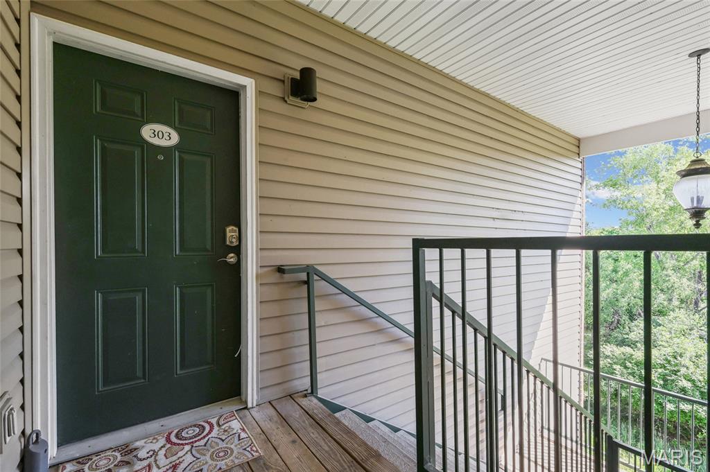 Welcome home to this beautifully updated 2 bedroom, 2 full bath condo in Valley Park! The vaulted ceilings create an open, airy feel, while modern upgrades shine throughout. New LVP flooring and cabinetry from 2021 pair perfectly with sleek granite countertops and a brand-new dishwasher installed in 2026. The kitchen opens seamlessly to the living space, ideal for everyday living or entertaining. Enjoy the convenience of an in-unit washer and dryer both included with the property. This condo also features an assigned covered parking space with functional layout, spacious bedrooms and full baths. This condo is ready for it's new owner to move right in! This association also allows for the new owner to rent the unit provided it is a standard 1 year lease no Airbnb or short term rentals.
Use the back stair to walk up to the unit through the breezeway. Front stairs do not connect to the unit.