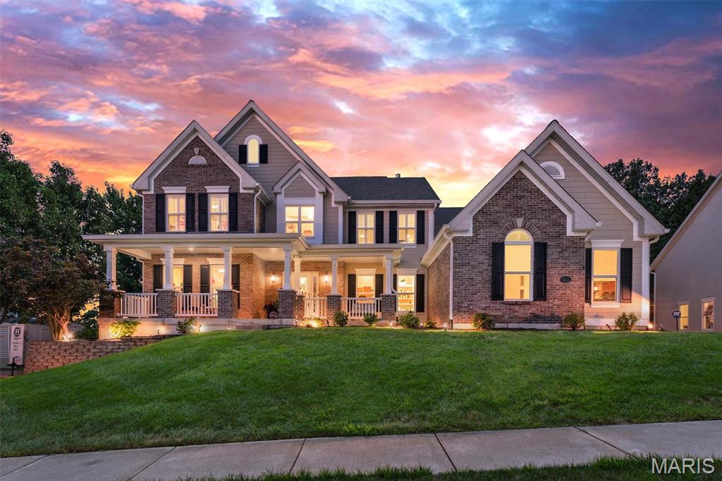 Set on a half-acre and backing to a fairway on Tapawingo National Golf Club, this five bedroom, four and a half bath home offers 6,127 square feet of finished living - 4,225 above grade plus a 1,902 square foot walk-out lower level. A two-story foyer opens to a great room with a wall of windows crowned by an arched Palladian, framing the golf course beside a gas fireplace. You will also find a formal dining room with crown molding and office when you enter the home.  

The updated kitchen delivers a granite island, six-burner JennAir gas range with chimney hood, JennAir built-in refrigerator, wall oven with warming drawer, walk-in pantry, and butler's pantry with beverage refrigerator. The vaulted hearth room and breakfast area open to a composite deck overlooking the course.

The main-floor primary suite features double-door entry, dual walk-in closets, and a vaulted bath with double vanity, separate shower, and soaking tub. Upstairs: a loft, a private ensuite bedroom, and two bedrooms sharing a bath.

The finished walk-out lower level is an entertainer's dream — recreation room, second full kitchen, theater with projector and surround sound, fitness room, fifth bedroom, and full bath opening to a resort-like yard.

Fresh paint and new carpet throughout (July 2026), roof and 6" gutters (2026), Hardie siding (2026), windows (2023), main-floor laundry, and an oversized three-car side entry garage. Lindbergh Schools and minutes to I-270/I-44.