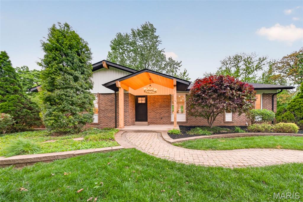 This one has been remade just for YOU! Absolutely stunning 4 bed, 2.5 bath open concept Ranch home boasting over 2800 sqft in a prime St. Charles location minutes away from shopping and dining but still quietly tucked away on over half an acre! You'll be wowed even before you head inside by a picturesque paver path past meticulous landscaping to an entryway built to impress! Inside, you're welcomed by a massive open concept foyer and dining space that is begging you to host all your important gatherings and holidays. The living room is a marvel with a soaring vaulted ceiling and brand new custom floor-to-ceiling stone wood burning fireplace to make the space cozy on cold nights! The gorgeous commercial grade kitchen has it all from stainless steel appliances, including a six-burner gas range, a MASSIVE island with seating, quartz counters and backsplash, custom cabinetry and a large pantry—you'll never get the chef of the house out of this dream! Set apart is the huge primary suite as a private oasis that features custom built-ins and a resplendent primary ensuite boasting gleaming tile and a dual adult height vanity with quartz counter! Down the hall, you'll find two more spacious bedrooms and the second full bath that is just as luxurious as the primary! This home already has all the bells and whistles but there's more! The walkout basement has been finished with everyone in mind! A large recreation room made for movie nights or a game room, a fourth bedroom that could also be converted to an office for the work from home lifestyle or a private reading nook, and a half bath! Everything has been set up to suit your needs AND give you room to make it your own! Last but not least, outside the expansive deck overlooks the breathtaking backyard with mature trees, plenty of level space for your garden and outdoor hobbies, and backing to tree lined woods for added privacy as you enjoy the warm weather months heading our way! Large two car tuck under garage & tons of extra parking because your friends are going to want to hang out here! This beautiful home has been fully renovated from the studs, everything is new! Agent Owned. Schedule your private showing before someone else is calling 1115 Grand Prix their home sweet home!
