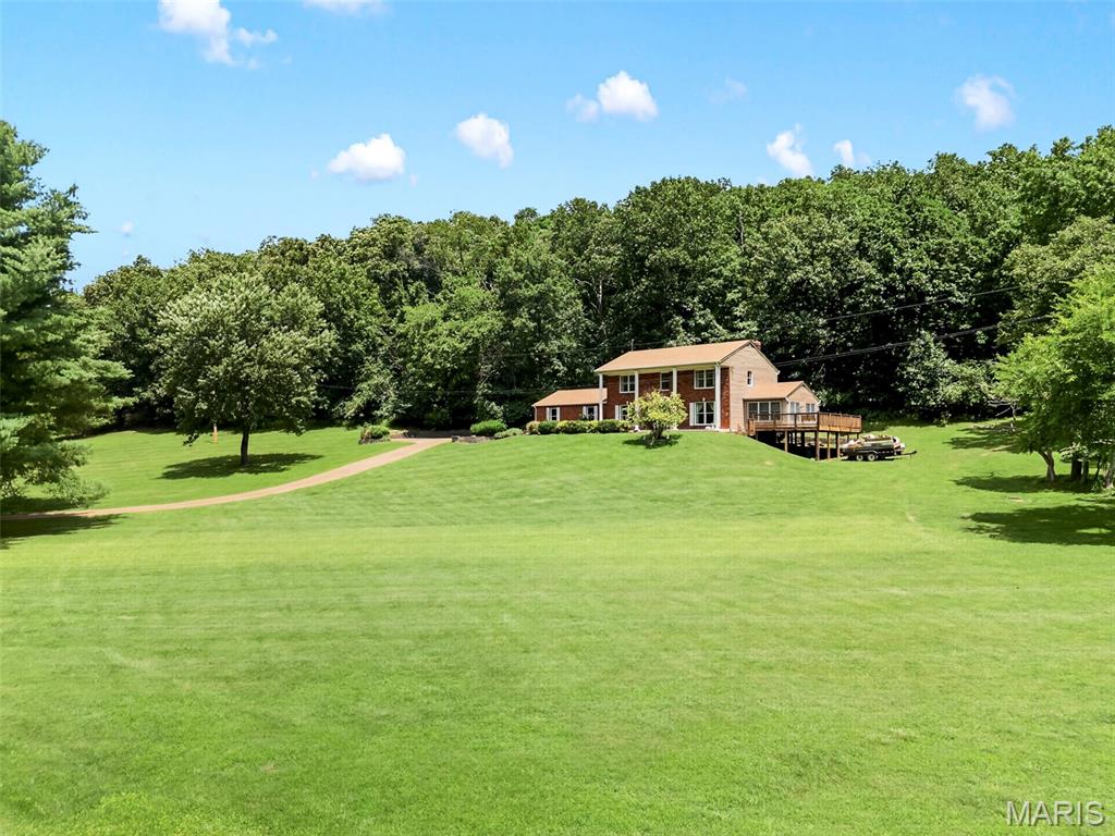 FIRST TIME ON THE MARKET!!! Equestrian Property Nestled on 3 picturesque acres in Wildwood within the award winning Rockwood School District, this two story residence offers an exceptional blend of Comfort and Privacy in one of Wildwood's most desirable settings!! It feels like HOME from the moment you step inside to this well maintained one owner, 4 bedroom, 2.5 bath spacious 2 Story. Main floor boasts open entry foyer, living and dining rooms, spacious family room with Wood Burning fireplace with built in surrounds on each side. Off of the living room you will find the sun room, which is perfect for an office, toy room, Reading Room, your options are endless. Open wet bar area off the family room, half bath, large breakfast room, planning desk, pantry, and door that walks out to your private backyard. Main floor laundry and closet space located off the 2 car attached garage. Second floor includes a spacious primary suite w/large walk-in his and hers closets, Soaking tub and Walk in Shower. The three secondary bedrooms are very roomy, the upstairs is complete with a full bath. Build your dream barn and bring your horses and chickens!! This picturesque property will not last long!! Home on 6 Acres is being sold for $799,999