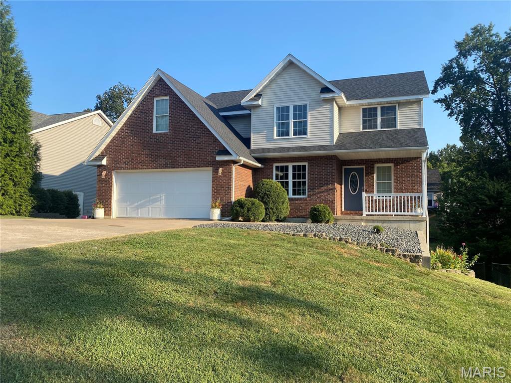If space is what you’re looking for, this home in the Ideal Villa Subdivision has plenty of it! With over 2,200 square feet of finished living space, five bedrooms, and 2.5 bathrooms, there’s room to spread out with even more potential downstairs. Step inside to a welcoming two-story foyer filled with natural light. The main level features a comfortable living room with a gas fireplace, a formal dining room, and a spacious kitchen with stainless steel appliances, breakfast bar, and plenty of room for an everyday dining table. Just off the kitchen, step onto the wood deck, a great spot for grilling, entertaining, or enjoying your morning coffee. A walk-in laundry and pantry area adds plenty of everyday convenience, along with an attached two-car garage. Upstairs, you’ll find four generously sized bedrooms, including a spacious primary suite. The primary bathroom features a jetted tub, separate shower, and an impressively large walk-in closet. Downstairs, the walkout basement adds a fifth conforming bedroom, while the remaining unfinished space offers excellent potential for additional living space, a rec room, home gym, office, or whatever best fits your needs. Walk right out to the backyard patio and fenced yard. With brand-new carpet and an HVAC system that's only about a year old, some important updates have already been taken care of. Located just south of Hannibal, this home offers plenty of finished space today with room to make it even more your own!