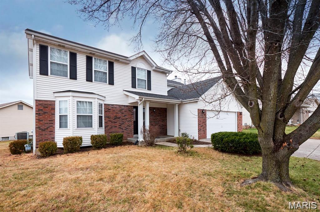 Welcome to this 2100+ square foot corner lot home featuring 3 bedrooms and 3.5 bathrooms, situated in a wonderful neighborhood! Upon entering, you'll discover a spacious front room to the left, complete with a bay window which leads into the separate dining area, great for hosting dinner parties. The kitchen with breakfast bar seamlessly connects to the living room, which boasts a cozy fireplace and sliding doors to the patio outside.  A half bath is conveniently located in the hall, as well as the laundry room being right off the kitchen.  As you head up, you'll find a bonus space at the top of the stairs, a full bathroom, and two well-proportioned bedrooms. The primary bedroom is exceptionally large, featuring a walk-in closet and an en suite that includes a separate shower, tub, and dual sinks. The finished basement offers a third full bathroom, along with a spacious recreational area equipped with a kitchenette. Adjacent to the rec room is a dedicated office space with a desk and storage. A sleeping area, complete with a built-in safe, is conveniently located near the stairs. The basement provides walk-up access to the flat backyard. Additionally, the oversized 2-car garage includes cabinetry for extra storage. The furnace, air conditioning unit, water heater and dishwasher are all relatively new. The  exterior walls were constructed with 2X6.