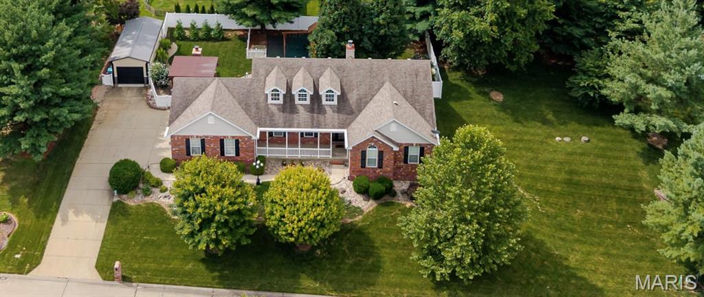Welcome to this stunning 4 bed/3 bath lake view home for sale that sits on half an acre. This home offers vaulted ceilings and an open concept floor plan that creates a bright and welcoming atmosphere. Warm wood floors throughout portions of the home adds beautiful character. Main floor features a spacious primary suite with walk in closet and private bathroom with jetted tub along with 3 bedrooms and additional bathroom. You'll appreciate the main floor laundry/mud room connected to your 3 car garage. Kitchen offers granite countertops, under cabinet lighting and spacious pantry. Downstairs you will find a room perfect for everyone in the family. Whether you have toys galore for a playroom, movie nights in your cozy movie room, or get some work done in your spacious office and let's not forget an extra storage room to keep everything organized. The back yard features a fire pit, sitting patio and spacious fenced in yard perfect for running around or planting a garden. New 12x30 shed with concrete floor and insulated garage door perfect for the extra storage for outside toys. Hot water heater 2017, Roof 2017, LVP in basement office and living area 2020, HVAC 2022, LVP in 3 bedrooms 2022, premium drop ceilings tiles in media room 2022,12x30 shed with concrete floor and insulated garage door 2023, Vinyl fence 2024,Kitchen sink and disposal 2026. Sellers have never used living room fireplace.  Swing set and rubber mulch is not staying.Buyer and buyers agent to verify all data.