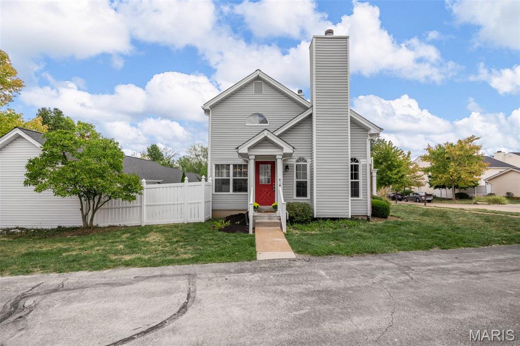 Completely remodeled 2-bedroom, 2.5-bath end-unit townhome with loft and a fully finished basement, ideally situated on a premium corner lot backing to woods and common ground for added privacy. The fully fenced yard is perfect for a small pet and outdoor enjoyment.

The main floor features a bedroom and full bath that can easily serve as a primary suite for single-level living, offering flexibility to fit your lifestyle. The stunning new kitchen showcases 42" soft-close cabinetry, quartz countertops, stainless steel appliances, and a bright breakfast room—plus a new stainless steel refrigerator (not shown). The living room impresses with hardwood floors, vaulted ceilings, floor-to-ceiling windows, and a charming brick wood-burning fireplace.

Upstairs, the spacious primary suite offers a private bath and is complemented by a versatile loft—ideal for a home office or play area. The finished lower level provides a generous rec space and half bath, perfect for entertaining or additional living space. A newer washer and dryer are also included for added convenience.

Additional updates include new HVAC, lighting, ceiling fans, and 6-panel doors with sleek black hardware. Enjoy a private back courtyard, two-car garage, and access to community amenities including pools, walking trails, playgrounds, and tennis courts.

Located within walking distance to Wildwood Town Center, this end-unit home offers the perfect blend of modern design, comfort, and an unbeatable location.  Showings Begin 5/2 AT 11AM at the Open House!