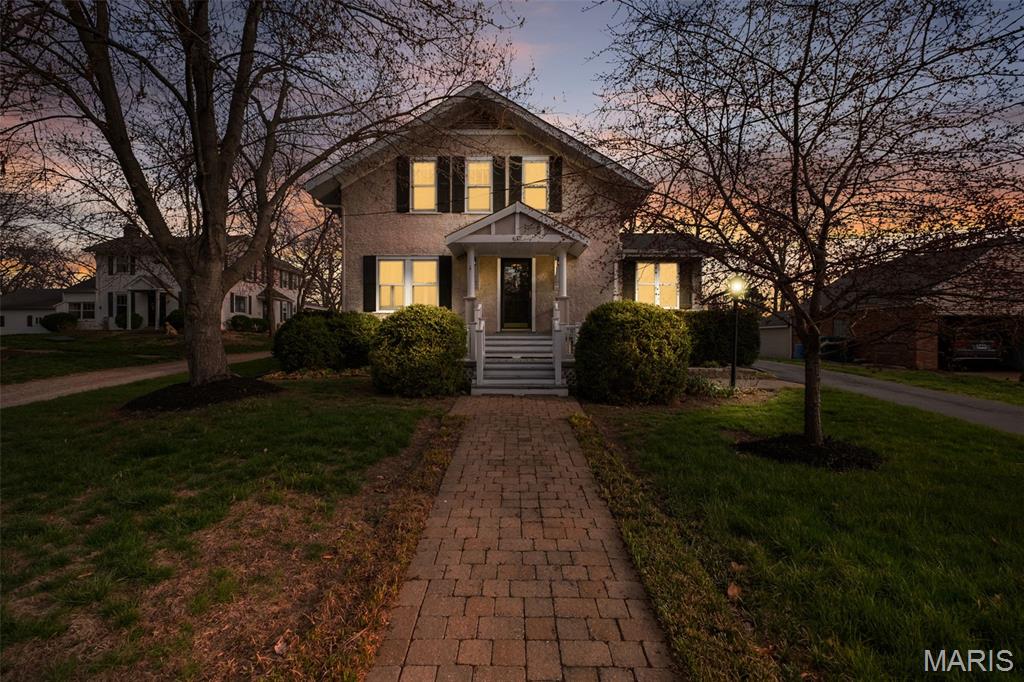 After more than 40 years with the same owner, 617 Lee Avenue offers a rare chance to own a true piece of Webster Groves. Set on a generous lot in the heart of Webster Groves, this classic craftsman delivers the charm, space, and livability people are searching for right now. Inside, you’ll find warm, inviting spaces filled with natural light and a layout that just works—from the country cottage kitchen with a custom banquette for easy, everyday dining to the spacious family room designed for gathering. A standout feature is the main-level office filled with light—perfect for working from home without sacrificing style. The primary suite offers the space and comfort buyers rarely find in homes of this era, creating a true retreat at the end of the day. Out back, the covered porch extends your living space and sets the tone for relaxed evenings, while the firepit and yard offer room to unwind or entertain. For anyone who needs space to create or tinker, the two-car garage with attached workshop is a major bonus. And the location is exactly where you want to be—just minutes from Old Webster’s shops and restaurants, all while being part of a block known for its pride of ownership. This is quintessential Webster Groves, with the space and features today’s buyers don’t want to compromise on—ready for its next chapter.