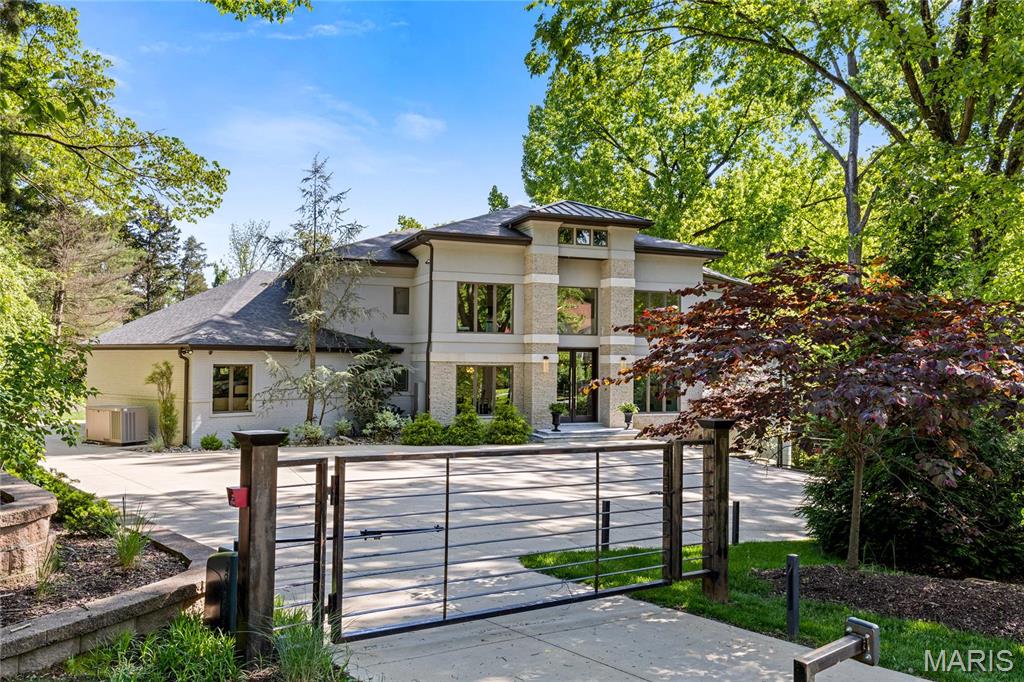 Sensational 7,339 sq ft Contemporary renovated & redesigned by Dick Busch Architects. Open floor plan features soaring ceilings, skylights & oak hardwoods that extend throughout the main floor. Impressive 9’ atrium doors lead to 2-sty foyer, study with sliding glass barn doors, formal dining room & stunning great room with cathedral ceiling, floor-to-ceiling slate fireplace & gathering bar. Designer kitchen with white cabinetry, quartz countertops, premium appliances & 13’ marble island adjoins breakfast room with wide bay window. Vaulted primary bedroom suite with morning bar, luxury bath with shower spa & private balcony offers an appealing retreat. Open staircase accesses 3 additional bedrooms, 1 with ensuite bath & 2 with Jack n’ Jill bath, & bonus room. Lower Level includes recreation room with fireplace & game room plus 2nd kitchen, workout room, 5th & 6th ensuite bedrooms, laundry & full bath. Situated on a 1+ acre lot with deck, patio with firepit, grilling station, pool & spa. Additional Rooms: Mud Room