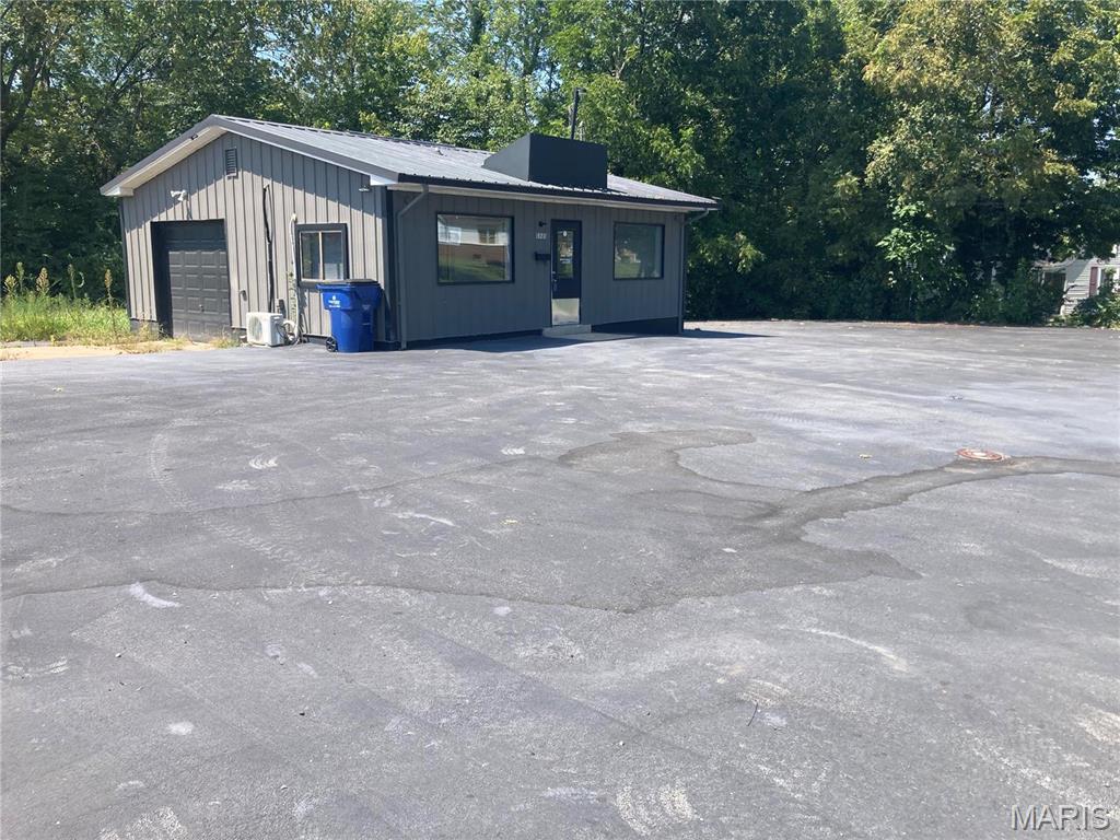 This can be used as a car lot & car wash. High traffic area. Building and lot, has 2 rooms for office and long and high garage with doors in both sides. Updated building and is located right by the street. Location High Traffic.