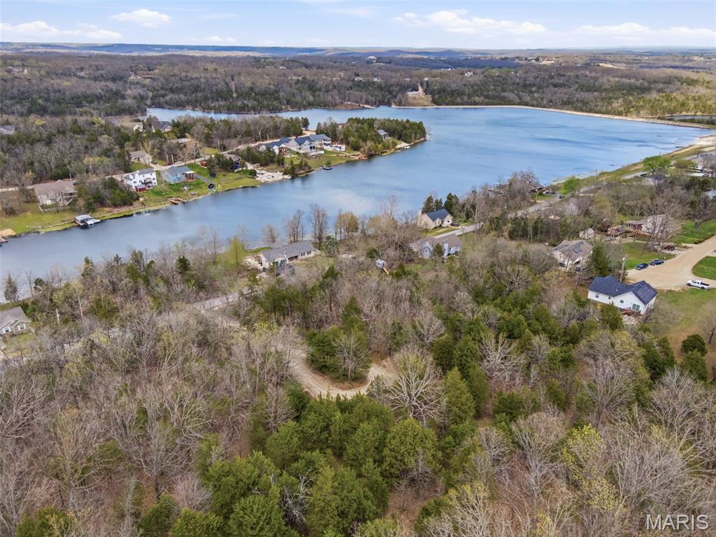 Beautiful lot nestled in the secluded Briarwood Estates, offering the perfect setting to build your dream home. Enjoy access to a private lake ideal for boating, swimming, and relaxing, along with a nearby golf club for added recreation. Located in the desirable Hillsboro School District and just a short drive to De Soto shopping, this property combines peaceful surroundings with everyday convenience. Plenty of space, privacy, and lifestyle all in one!