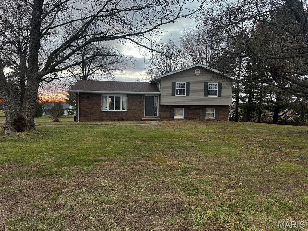 Looking for a great home in a great area!  Dont miss this 3 bed, 2 bath house sits on a 1 acre lot just on the edge of Greenville. Home features split level floor plan with a large living room and kitchen/dining combo on the main level that overlooks the large backyard. Upstairs features the master suite, 2 other bedrooms and a full hall bathroom. There is a lovely family room with a brick wood burning fireplace, a half bath and a walkout to the backyard.  The 2 car attached garage is tucked under the main level in the other half of the basement (no garage doors visible to the street). Laundry area is also in garage area.  Roof-2025, HVAC-2018, Water Heater-2021, Garage Doors-2021, Microwave-2022.