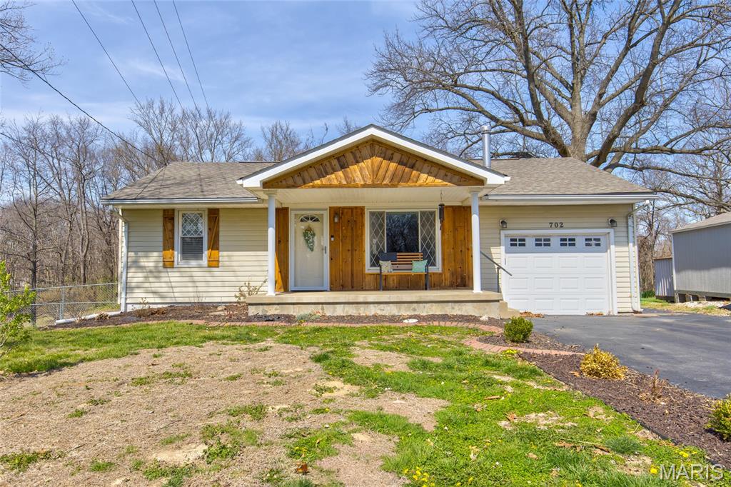 Great Rosewood Heights location, Roxana School District. Close to highways, shopping and bus routes. Don't miss this completely updated two bedroom home with a single car attached garage and full walk out basement.  This home is located on a large lot at the end of a quiet dead end street.  The back yard has a fenced area for pets and features a beautiful above ground pool with deck, both added in 2023.  New roof 2025, main bath remodel 2020, LVP flooring added in 2025