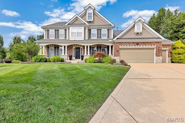 Welcome to this exceptional Wildwood home where timeless elegance meets extensive, high-end updates. Situated on a quiet cul-de-sac in the highly sought-after Rockwood School District, this impressive 4-bedroom, 3.5-bath residence offers over 3,700 square feet of beautifully designed living space with more than $200,000 in premium improvements.

Step inside to find refinished hardwood floors, a dramatic two-story great room with a floor-to-ceiling wall of windows, and a stunning wood burning stone fireplace. The chef's kitchen features custom cabinetry, granite countertops, a massive center island with double-thick granite, high-end stainless steel appliances, designer backsplash, and multiple wine chillers—perfect for entertaining. The adjoining vaulted hearth room offers a gas fireplace and panoramic views of the private backyard.

The luxurious main-floor primary suite has been thoughtfully redesigned with a spa-inspired bath, custom walk-in closet, and upscale finishes throughout. Upstairs you'll find a spacious bonus room along with three generously sized bedrooms, including one with an oversized walk-in closet and private bath and a Jack-and-Jill layout to accommodate family and guests.

Outside, enjoy professionally landscaped grounds, an inviting stamped concrete patio, professionally installed landscape and patio lighting and exceptional curb appeal enhanced by the striking stone and brick exterior. With a three-car garage, main-floor laundry, and an unbeatable location near parks, shopping, restaurants, and top-rated Rockwood schools, this home truly offers the perfect blend of luxury, comfort, and convenience. This is a rare opportunity to own a meticulously updated home in one of Wildwood's most desirable neighborhoods.