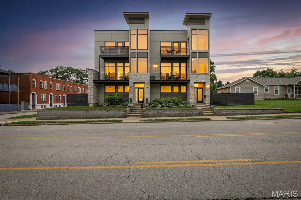Location, Location, Location!  Just minutes from everything the city has to offer for dining, shopping, and entertainment! This custom built 3-bedroom, 3-bathroom, 3-story townhome in the heart of Lafayette Terrace of The Gate District was designed with modern finishes, functional living spaces and constructed with high quality materials and maximum efficiency in mind; 2x6 walls, 15-inch wall firewall, dual zoned heating and cooling, a TPO roof, and Hardie board siding. 

 The lower level (ground floor) hosts a welcoming foyer and rec room that could also be the perfect space for a home office, additional family room or sleeping area. The oversized, insulated and attached 2 car garage with 8 ft height doors provides amble parking for larger vehicles and additional storage space (25ftx25ft). Tucked just under the stairs, there is also a built-in dog door providing easy access for pets to the partially fenced side yard. 

The main floor (2nd floor) offers a spacious open floor plan, 10 ft. ceilings, hardwood flooring and half bathroom. This area was made for entertaining with the kitchen at the heart of it; featuring custom cabinets, tile backsplash, and a large quartz waterfall island. Enjoy the outdoor living space on the private back deck or watch the world go by out on the covered front balcony.  

The upper level (3rd floor) hosts a sprawling primary en-suite with its own private balcony offering views of The Gateway Arch and The Union Station Ferris Wheel.  The primary bathroom features a dual vanity sink, custom tile shower with glass doors, waterfall shower head, and large walk-in closet. Both secondary bedrooms are nicely sized with large closets. The hall bathroom and laundry area complete the third floor. 

Move in ready, with all appliances, washer & dryer, custom leather sectional sofa, dining table / chairs, barstools, 3 flat screen tv's, surround sound speakers and receiver, outdoor speakers front and back to stay with the home. The property  has no HOA fees and has already passed St. Louis City occupancy inspection. This home is conveniently located and close to everything!  Lafayette Square Park, 0.5 mile / Soulard Historical District and Farmers Market, 1.3 miles / Energizer Park, 1.8 miles / Botanical Gardens 1.9 miles / Enterprise Center, 2.1 miles / Busch Stadium, 2.5 miles / The Arch, 2.9 miles / St Louis Zoo, 5.4 miles.  With easy access to Highway 44, 55, and I-70.