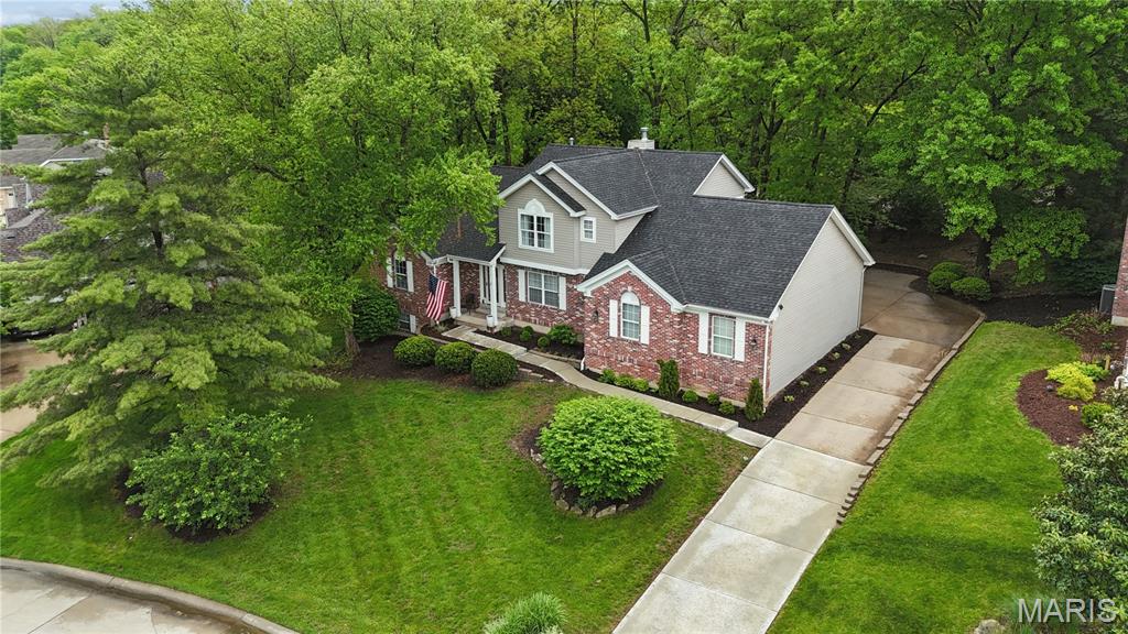 Fabulous One And A Half Atrium In The Prestigious Moorings Subdivision At Lake St Louis!
Step through the front door into a bright foyer with soaring vaulted ceiling that opens to the elegant formal dining room accented with crown molding. The stunning great room features a dramatic high ceiling, a cozy fireplace and an impressive wall of floor to ceiling windows overlooking the beautifully shaded backyard! Enjoy outdoor living on the stamped concrete patio, freestanding deck and charming gazebo! Fall I love with the newly remodeled chef’s kitchen, showcasing custom cabinetry, Quartz-ite countertops, a huge center island, stylish backsplash, pot filler over gas cooktop, and convenient Butler’s pantry connecting to the spacious main floor laundry room. The adjoining breakfast room offers a bay window and a warm inviting place to start your day! The main floor primary suite boasts a vaulted ceiling, luxury bath with whirlpool tub, walk in closet, and an additional den, perfect for home office or quiet retreat! Upstairs, you will find two generous bedrooms connected by a jack and jill bath, plus a wonderful loft space ideal for a playroom, study area or lounge! The walkout lower level expands your living space with a large family room featuring a second fireplace, a recreation room with wet bar, a den office, fourth bedroom and full bath—perfect for guests or multi-generational living!
Enjoy all the amenities that Lake St Louis offers!!