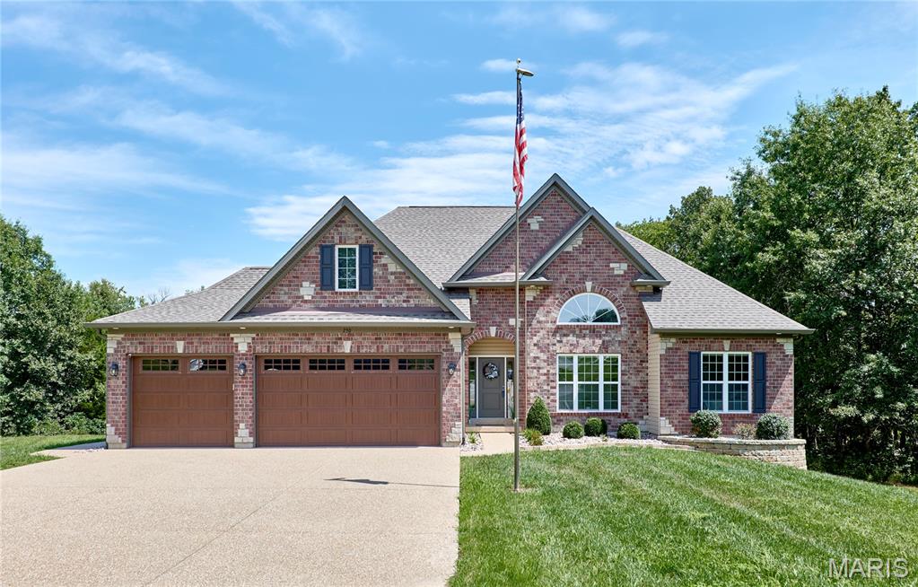 2.5 ACRES, PRIME LOCATION & ONLY 4 YEARS NEW! This beautifully maintained 3BR/2.5BA home shows just as beautifully as it photographs! Tucked at the end of a quiet cul-de-sac with no through traffic, paved roads, mature trees, and a private 2.5-acre setting, this property offers the perfect combination of space, privacy, and modern finishes. Step inside to wood flooring throughout the main living areas, impressive 11' ceilings with 9' ceilings throughout the remainder of the home, and a thoughtfully designed open floor plan enhanced by beautiful transom windows spanning the back of the home, bringing in abundant natural light and showcasing the private, tree-lined setting. The stunning kitchen is a showstopper with 42" staggered cabinetry, quartz countertops, stainless steel appliances, large island, breakfast bar, and walk-in pantry with custom organizers. The spacious primary suite features dual vanities, an oversized walk-in shower, and large walk-in closet with organizers. The main-floor laundry offers additional cabinetry and workspace, with a conveniently located half bath near the garage. The fully finished 3-car garage is equally impressive with epoxy flooring, built-in workbench area, and a walkout door to the side yard. Outside, extensive landscaping, an aggregate driveway, covered back porch, walkout lower level, and patio overlook the private backyard—with plenty of room for that future inground pool! Beautifully maintained, thoughtfully designed, and perfectly positioned on 2.5 acres—this one truly checks all the boxes! Builder 10 year warranty remaining.