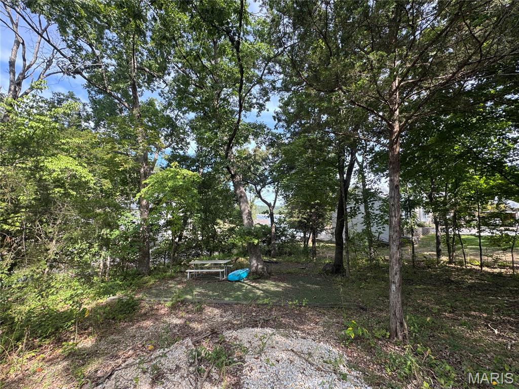 Don't miss out on this premier lot with views of Autumn Lake located in the sought out gated subdivision of Raintree Plantation. It is like being on vacation every day with our resort style amenities. It features: Country Club with a restaurant, pool, fitness center, Pickleball and a 18 hole golf course. Community amenities include: 4 private lakes for boating, kayaking, paddle boarding, fishing including varies tournaments, private beach, campgrounds and sand volleyball, concrete pavilion with grill for special occasions. This golf cart friendly place is just waiting for you to come build your own home and start enjoying this resort style living. This ideal lot with lake view has water, sewer, electric, and all utilities available just waiting for you to bring your own builder and make it reality. Come see it today! Gated community must have code to get in.