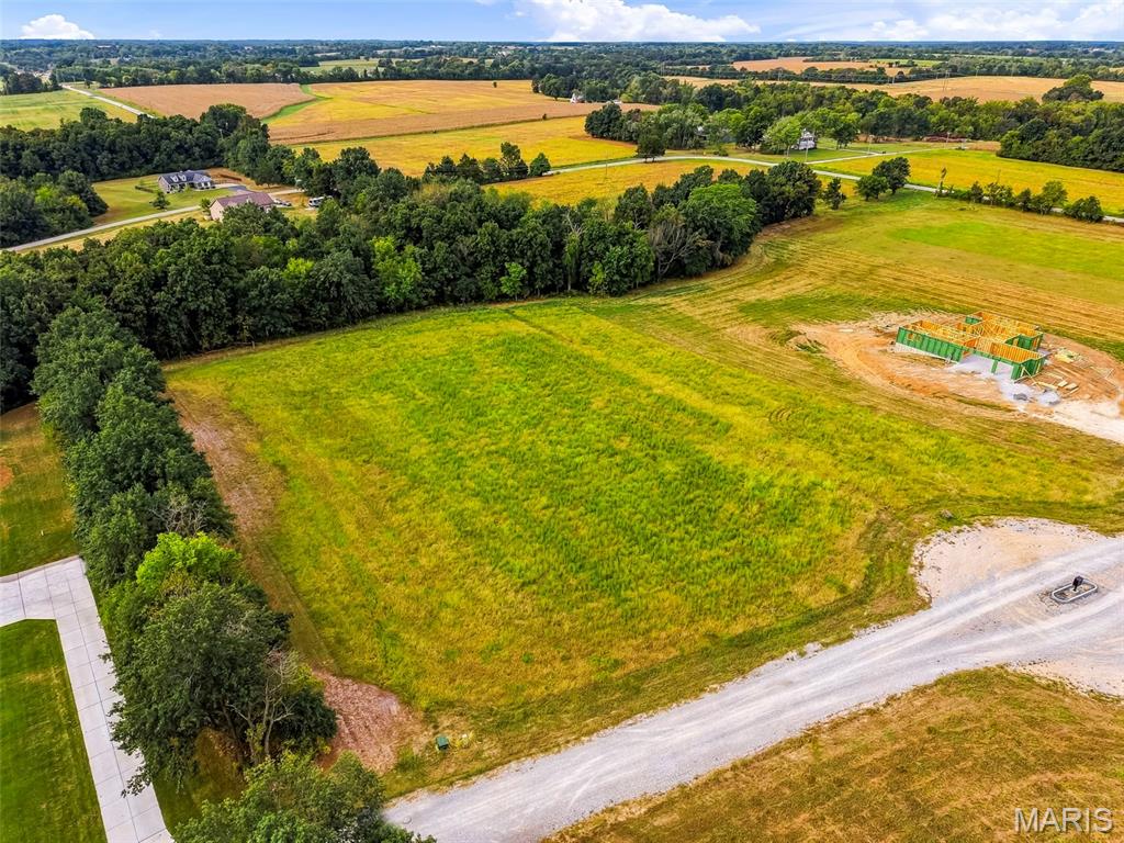 Looking for the perfect spot to build your dream home?  Look no further than this beautiful 3-acre homesite in Winchester Estates, an exclusive acreage subdivision in Wright City! This wooded, gently sloping lot offers a private setting with a mature tree line along the rear and a natural tree-lined division between the property and neighboring lot, creating a peaceful sense of privacy. The slope of the property provides an excellent opportunity for a walkout lower level.

Winchester Estates features 12 spacious lots ranging from 3 to 3.22 acres, offering the privacy and tranquility of country living while remaining conveniently close to Highway 70 and major roadways for an easy commute. Custom homes must have a minimum of 2,100 square feet and include at least 25% brick or stone on the exterior. Add a spacious 600+ square foot detached building, perfect for a workshop, garage, storage, or hobby space. Chickens are permitted, and boats and RVs may be stored behind the home or garage.

Located in unincorporated Warren County, this is a fantastic opportunity to build a custom home with plenty of room to enjoy the outdoors while still being close to everyday conveniences. A copy of the subdivision restrictions is available upon request.