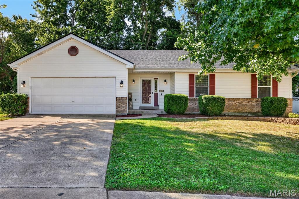 Welcome home to 206 Geranium Dr! This inviting ranch offers the open, easy-living layout you’ve been looking for, tucked on a lot that backs to trees for an added sense of privacy and peaceful surroundings. Step inside to vaulted ceilings and an open-concept main level with fresh paint and new flooring throughout. The spacious primary suite features a private bath and walk-in closet, while the lower level provides even more open living space with plenty of room to spread out, entertain, work from home or create the space that fits your lifestyle. Enjoy the convenience of quick access to Highway K while being tucked away from the hustle and traffic. An open layout, finished lower level, peaceful setting and convenient O’Fallon location make this one you won’t want to miss!