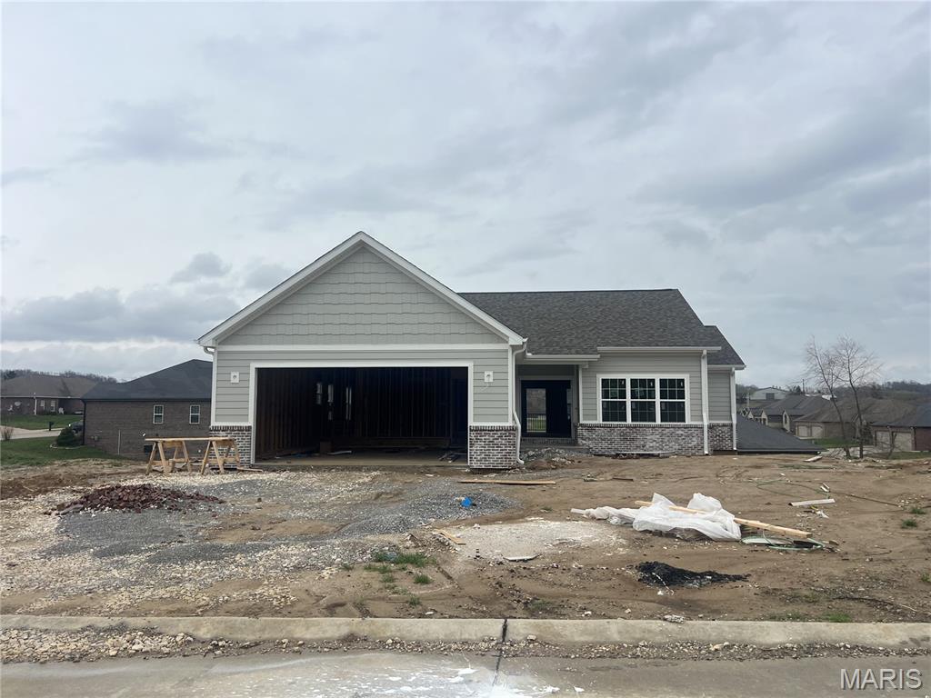 New construction located in Baldwin Farms Subdivision. Built by Forefront, this 3 bed 2 bath home offers a bright, open floorplan. The kitchen has granite countertops, shaker style cabinets, and a large center island, plus a split floor plan with main level laundry and primary ensuite. Dining area overlooks a covered deck, perfect for entertaining and enjoying beautiful days. Full unfinished walk out basement for storage and room to grow. With easy access to I55, this home is ideal for those looking for a tranquil and modern living space with a convenient location.
