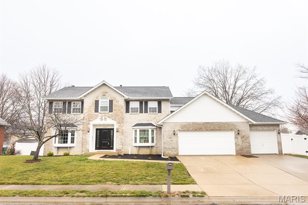 Beautifully updated 5 bedroom, 3 bath two-story home offering over 3,000 sq ft of living space! A welcoming open foyer is flanked by formal living and dining rooms and leads into the spacious family room featuring a fireplace and bay window with views of the backyard. The eat-in kitchen offers a center island, abundant cabinetry and access to the composite deck, perfect for entertaining. Upstairs you'll find a vaulted primary suite with a fully remodeled luxury bathroom (2025) featuring a double vanity, walk-in tiled shower and spacious closet. Four additional bedrooms provide plenty of space, including a large 21x17 bedroom ideal for a guest suite, playroom or office. The walk-out basement includes a custom home gym and offers great potential for additional finished living space. Outside, enjoy the large fully fenced backyard and the convenience of a three-car attached garage. In addition to a new roof, other recent updates include new window and front door (2025), attic insulation (2025), HVAC (2024), new fence (2024), and main floor LVP flooring (2023).  This home is truly stunning and offers the perfect combination of space, updates and move-in ready comfort.